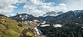 Aerial view of Val di Funes with snowy peaks, Puez-Odle Nature Park, South Tyrol, Italy.
