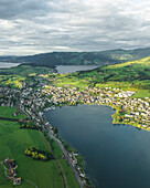 Aerial view of Kussnacht am Rigi, a small town along the Lake Lucerne at sunset with the Lake Zug (Zugersee) in background, Schwyz, Switzerland.