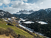 Aerial view of Val di Funes with the majestic Dolomites in the background, South Tyrol, Italy.