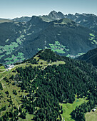 Aerial view of the mountain ridge at the top of Alpe di Siusi (Seiser Alm) on the Dolomites mountains with Secede peak in background, Ortisei, Trentino, South Tyrol in Northern Italy.