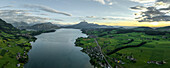 Panoramic aerial view of Lake Lucerne at sunset with Mount Pilatus in background, Alpnach, Switzerland.