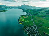 Aerial view of Mount Pilatus at sunset from Lake Lucerne, a mountain peak in Alpnach, Switzerland.