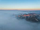 Aerial view of Balze Valdarno with fog and mist at sunrise, Piantravigne, Tuscany, Italy.