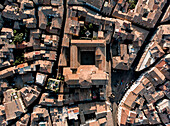 Aerial view over the streets and old rooftops of Viterbo, Italy.