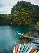 Aerial view of a man jumping from a pier in Tagana-an, Surigao del Norte, Philippines