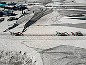 Aerial view of fishing boats and fishing nets at fishery ghat in a beautiful coastal landscape, Cox Bazar, Bangladesh.