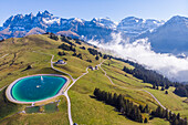 Aerial view of an artificial lake on mountain top in Champéry, Valais, Switzerland.