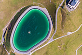 Aerial view of an artificial lake on mountain top in Champéry, Valais, Switzerland.