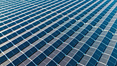 Aerial Drone top-down view of reflective solar panels, green energy farm, The Netherlands.