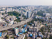 Aerial view of akhtaruzzaman flyover and muradpur flyover amidst bustling cityscape and dense buildings, Chittagong, Bangladesh.