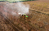 Aerial View of sprinkler at work in almond plantation. Mishmar HaYarden, Israel.