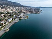 Aerial view of coastal town with high perspective over Lake Neuchatel, Neuenburg, Switzerland.
