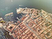 Aerial view of old city of Dubrovnik (Croatia) above Stradun and port, popular tourist attraction on Adriatic. Post processed with vintage filter.