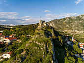 Aerial view of the Klis Fortress over a mountain in Klis, Croatia