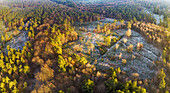Aerial view of open fields with frost in forest during winter, Amerongse Berg, national park Utrechtse Heuvelrug, Utrecht, Netherlands.