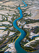Aerial view of winding river through greenery and wetlands, Accident Inlet, Gulf of Carpentaria, Karumba, Queensland, Australia.