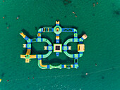 Aerial view of a water park in the turquoise waters of Medulin, Croatia.