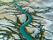 Aerial view of meandering river through wetlands and mangroves, Accident Inlet, Gulf of Carpentaria, Karumba, Queensland, Australia.