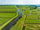 Aerial view of canal Enkele Wiericke and meadows of Polder Sluipwijk and Polder Lange Weide, Bodegraven-Reeuwijk, Zuid-Holland, Netherlands.