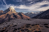 Aerial view of the Taboche (6,542 m) mountain in the spring season, near Ama Dablam base camp, Himalaya, Nepal. Shot was taken in the early morning, a few moments after sunrise.