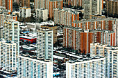 Aerial view of modern highrise buildings and urban architecture in a snowy landscape, Moscow, Russia.