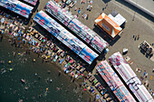 Anapa, Russia - 23 July 2008: Aerial view of a bustling beach with colorful umbrellas and tents under the summer sun, Anapa, Russia.
