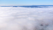 Aerial view of serene and tranquil clouds over a vast and beautiful landscape, Eichenzell, Germany.