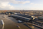 Aerial view of Amsterdam Central station, The Amsterl River and the Zuidas skyline in The Netherlands.