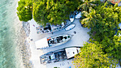 Aerial view of abandoned boats, dhonis at the local shore of local island Omadhoo, Alif Dhaal Atoll, Maldives, Indian Ocean