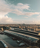 Aerial view of Amsterdam Central station, The Amsterl River and the Zuidas skyline in The Netherlands.