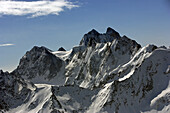 Aerial view of snowy peaks in the majestic Caucasus Mountains, Kabardino Balkar Republic, Russia.
