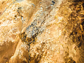 Aerial view of a volcanic hot spring with sulphuric smoke, Namafjall Hverir viewpoint, Northeastern Region, Iceland.