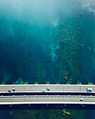 Aerial view of vehicles driving on a bridge over a swamp in Antalya, Turkey.