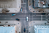Aerial view of fast blurry cars traffic moving across crossroad in Kaunas city, Lithuania.