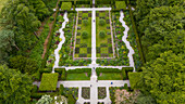 Aerial view of a beautiful formal garden with lush trees and manicured hedges, Exeter, England.