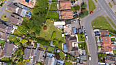 Aerial view of a beautiful garden party in a residential neighborhood with houses and greenery, Reading, United Kingdom.