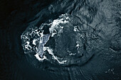 Aerial view of humpback whale tail above water surface near Baja California Sur, Mexico.