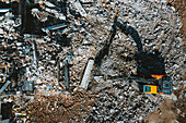 Aerial view of old building demolition work process in construction site in Kaunas city, Lithuania.