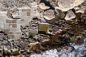 Aerial top down view of square formations in the rocky coast near Valletta, Malta island.