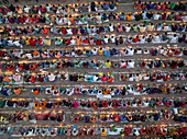 Sonargaon, Bangladesh - 09 November 2024: Aerial view of vibrant festival gathering with rows of seated people celebrating traditions, Baradi, Sonargaon, Bangladesh.