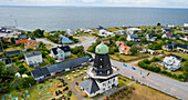 Aerial view of a picturesque village with traditional architecture and a charming mill by the tranquil sea, Oland Island, Sweden.