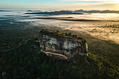 Aerial view of sunrise over the famous Sigiriya Rock Fortress called Lion Rock, Sri Lanka.