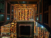 Aerial view of the kartik vrata festival with people gathered around a beautifully lit temple, Gendaria, Dhaka, Bangladesh.