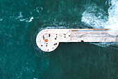Aerial view of harbour pier and lighthouse in Mediterranean Sea, Valletta, Malta.