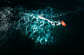 Aerial view of kitesurfer crossing the ocean at Kite Beach in Santa Maria, Sal, Cape Verde.