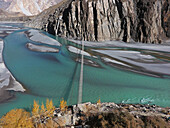 Aerial view of Hunza River with Passu Cones and autumn trees, Hunza, Gilgit-Baltistan, Pakistan.