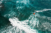 Aerial view of kitesurfer crossing the ocean at Kite Beach in Santa Maria, Sal, Cape Verde.