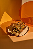 Babka with black garlic, cheese and roasted spring onions