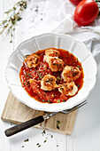 Monkfish cheeks in tomato ragout