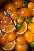 Citrus fruits in boiling water